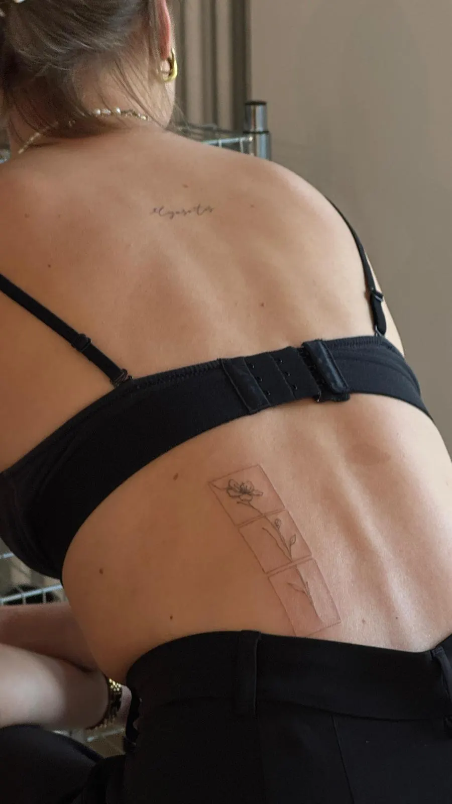 Large back tattoo lettering and flowers panel fine line