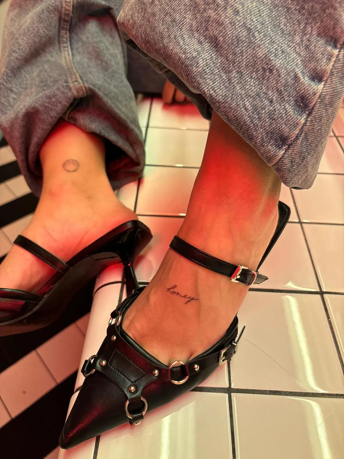 Mini lettering ankle tattoo with heels editorial