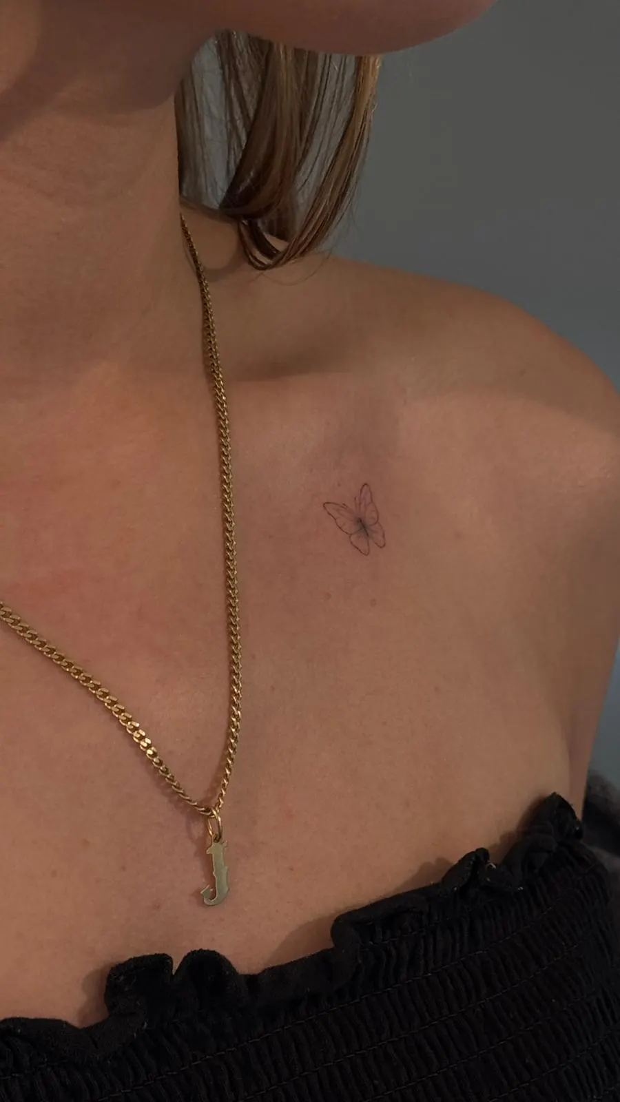 Mini butterfly and key tattoo on leg